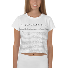 Load image into Gallery viewer, Model showcasing the CIA Clothing &amp; Prints USA Independence Crop Top, expressing the spirit of freedom and liberty through this stylish wardrobe staple.