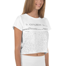 Load image into Gallery viewer, Model showcasing the CIA Clothing &amp; Prints USA Independence Crop Top, expressing the spirit of freedom and liberty through this stylish wardrobe staple.