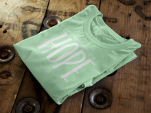 Load image into Gallery viewer, Light Green Tee Folded on Wood - Whisper of Whimsy