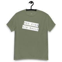 Load image into Gallery viewer, Funny Weed Shirt: Spread Love and Compassion with RED EYES BIG SMILE - Army Green Hanger