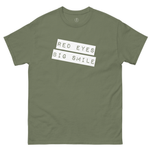 Load image into Gallery viewer, Funny Weed Shirt: Spread Love and Compassion with RED EYES BIG SMILE - Army Green Flat Laid out