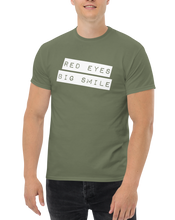 Load image into Gallery viewer, Funny Weed Shirt: Spread Love and Compassion with RED EYES BIG SMILE - Model Man Pose